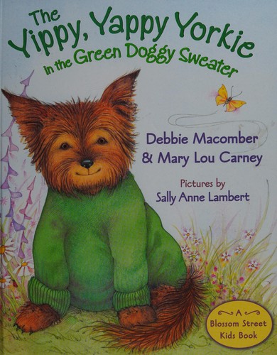 The yippy, yappy Yorkie in a green doggy sweater