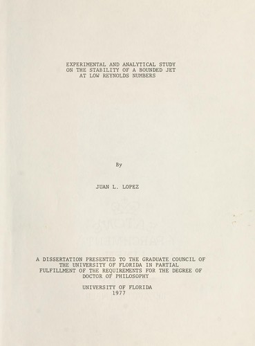 Experimental and analytical study on the stability of a bounded jet at low Reynolds numbers